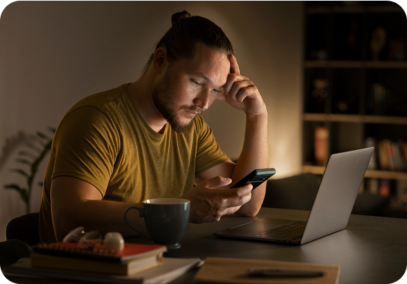 Tensed Men looking at Mobile